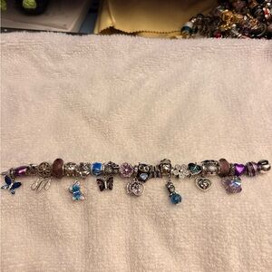 Linx bracelet with owl and butterfly charms